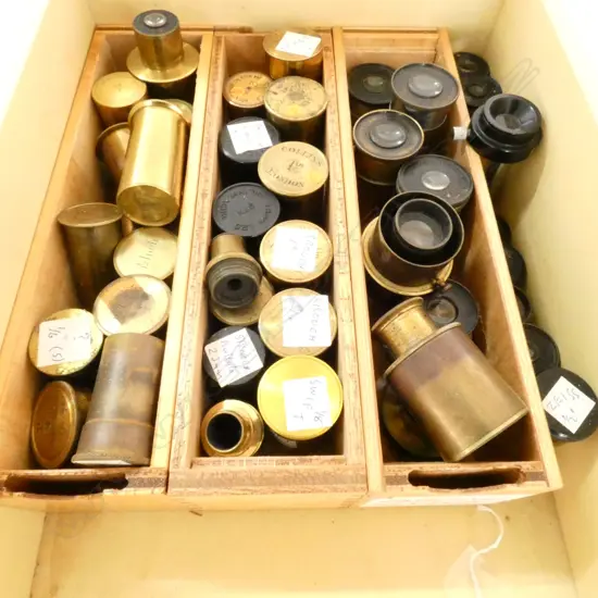BOX OF ASSORTED MICROSCOPE LENSES MANY IN BRASS CANISTERS